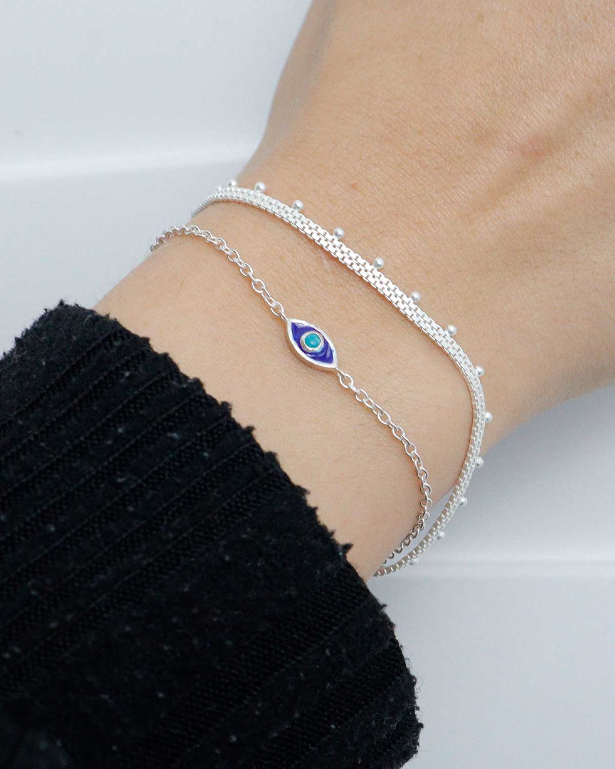 Front view of silver evil eye bracelet with turquoise gemstone