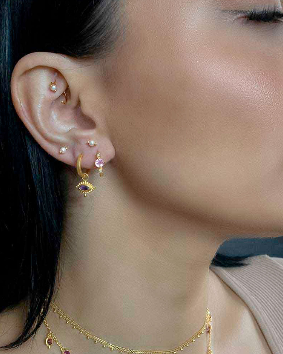 Silver mini hoops worn without gemstone charm for a minimal look