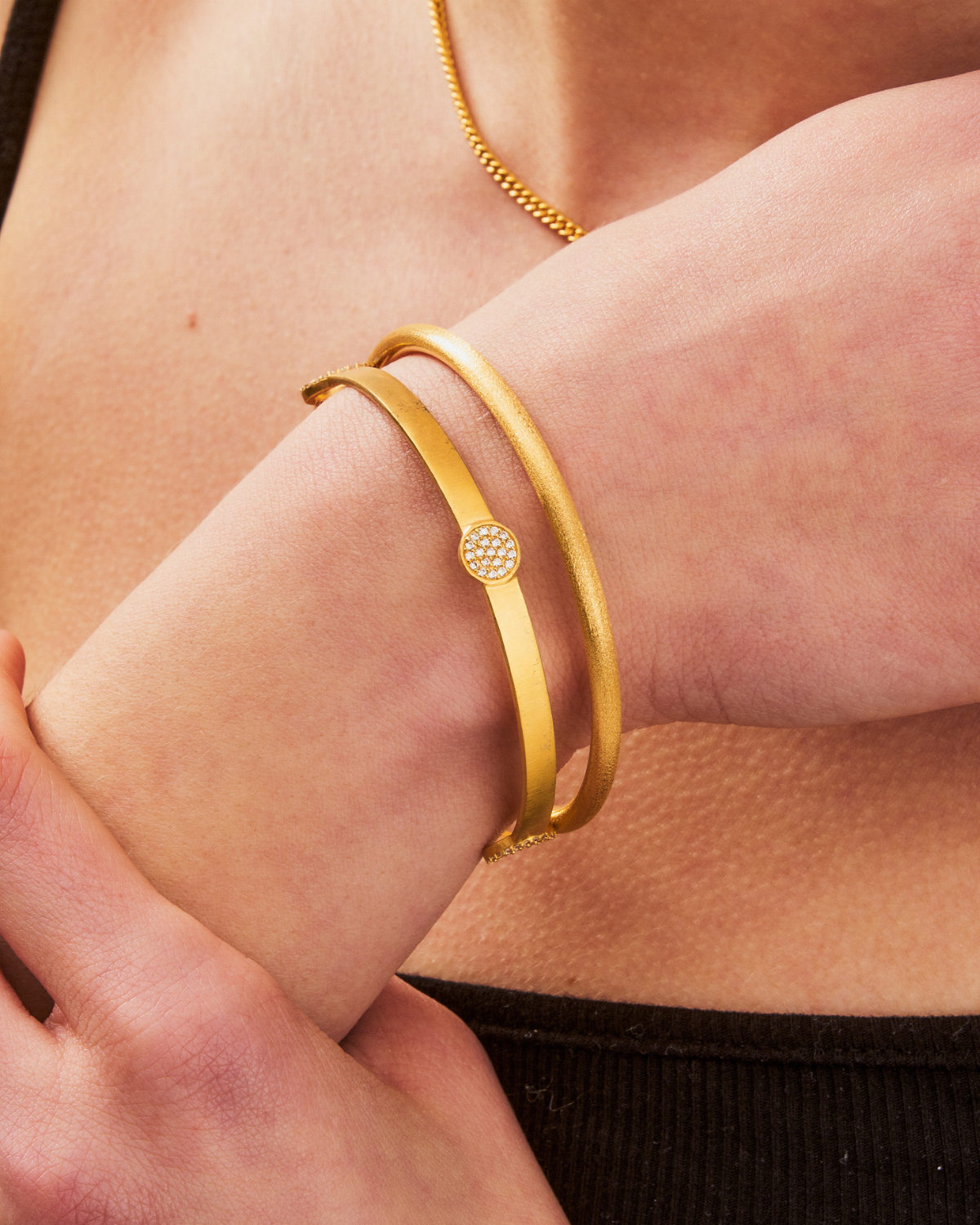 Close-up of gold bangle with AAA grade crystal detailing