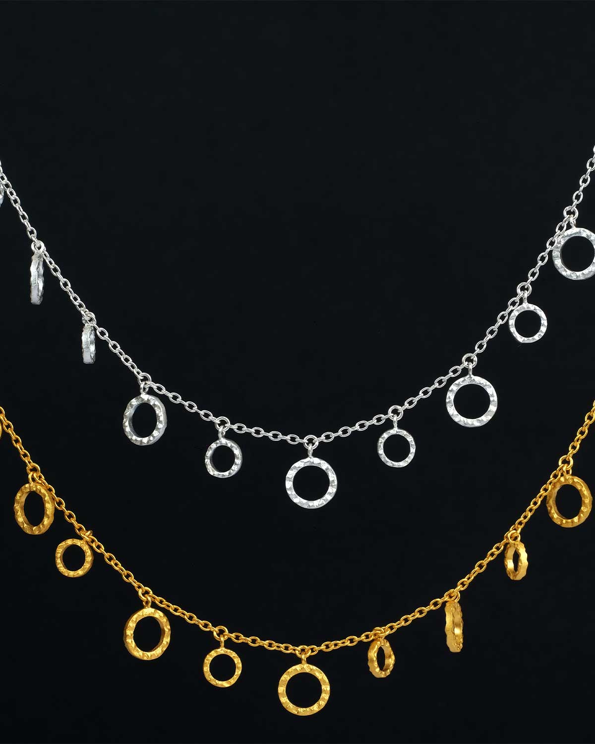 Detailed view of hammered texture on gold disc necklace
