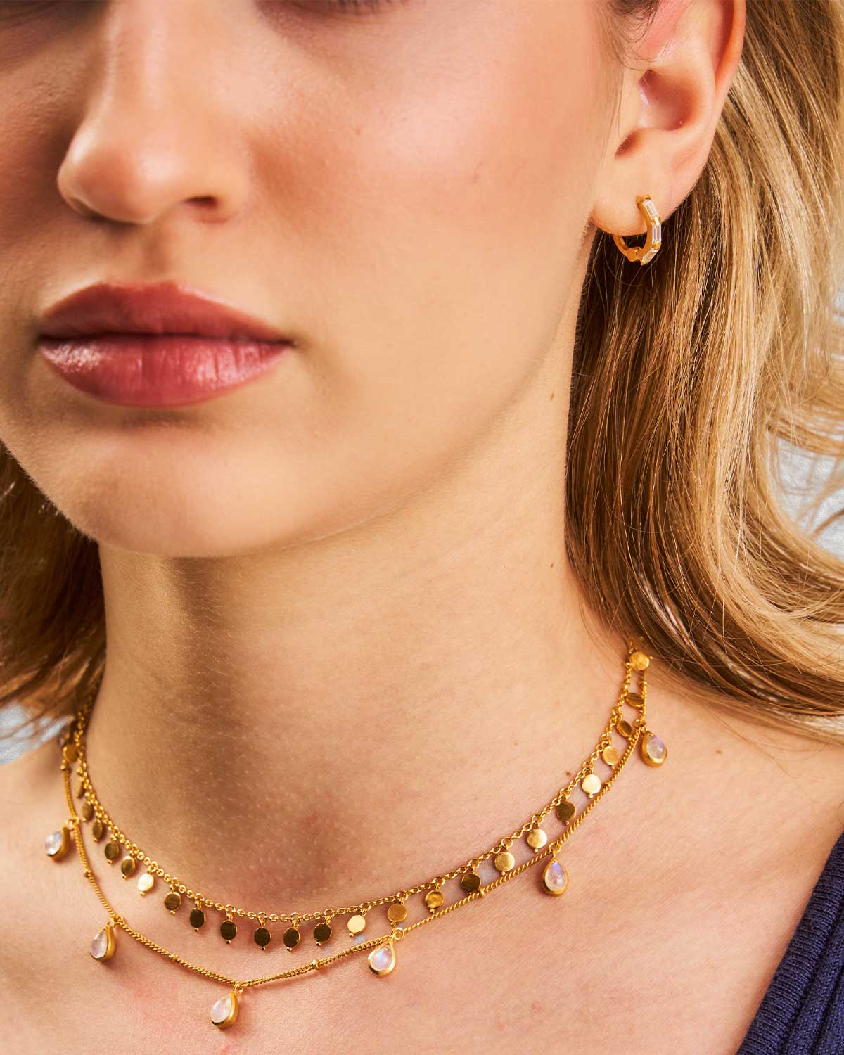 Lightweight and comfortable gold mini hoop earrings with baguette cubic zirconia