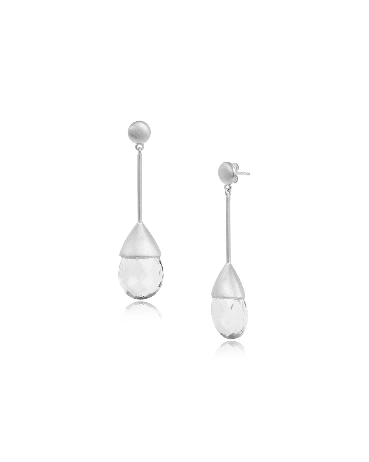 Close-up of drop earrings showing hand-cut natural crystal gemstones and polished finish