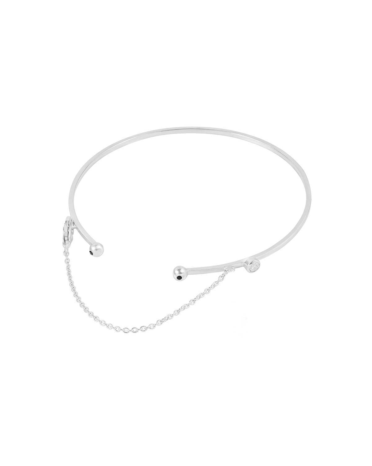 Front detail of silver arm cuff highlighting gemstone arrangement and shine