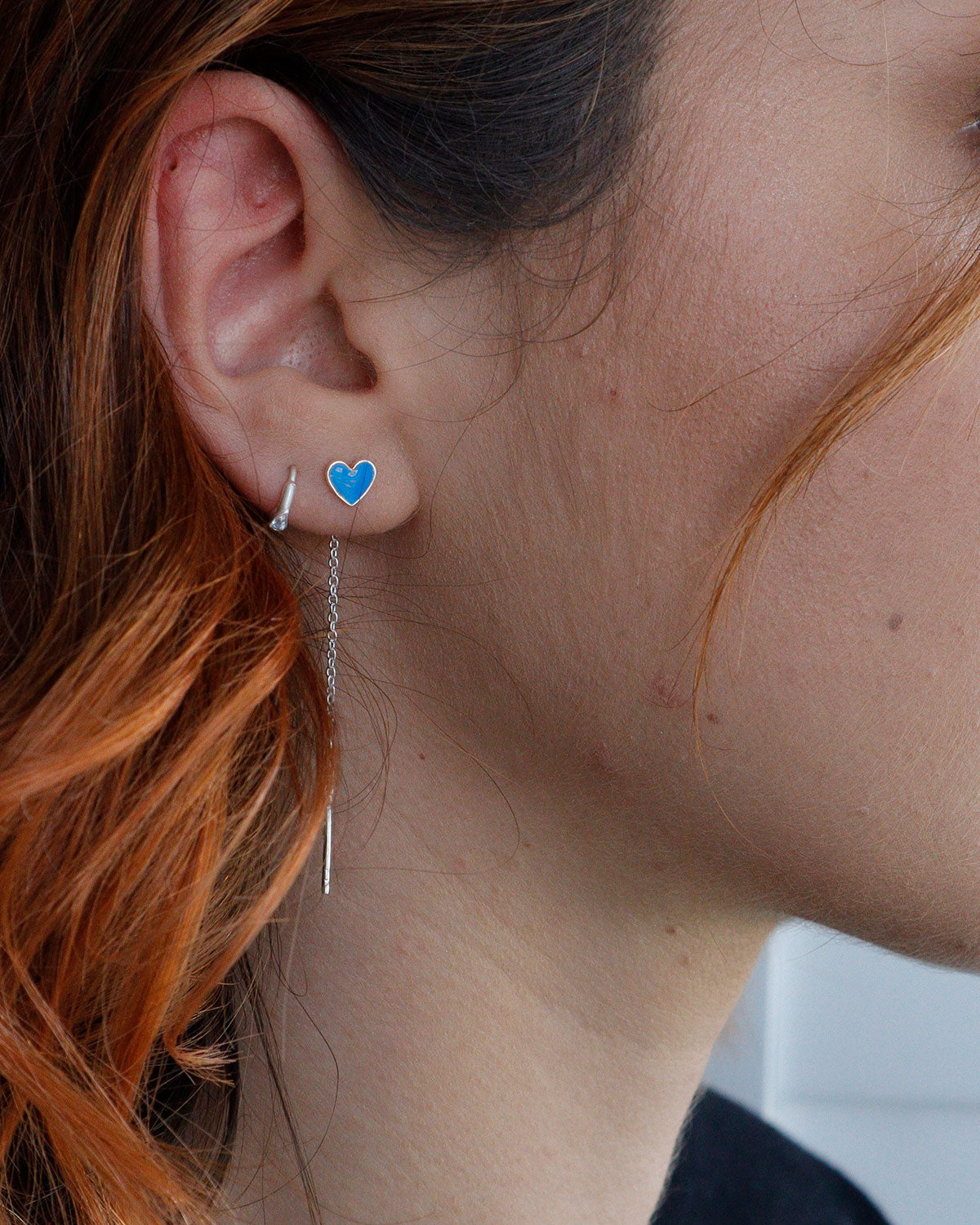 Minimal gold earrings with small red enamel heart drops