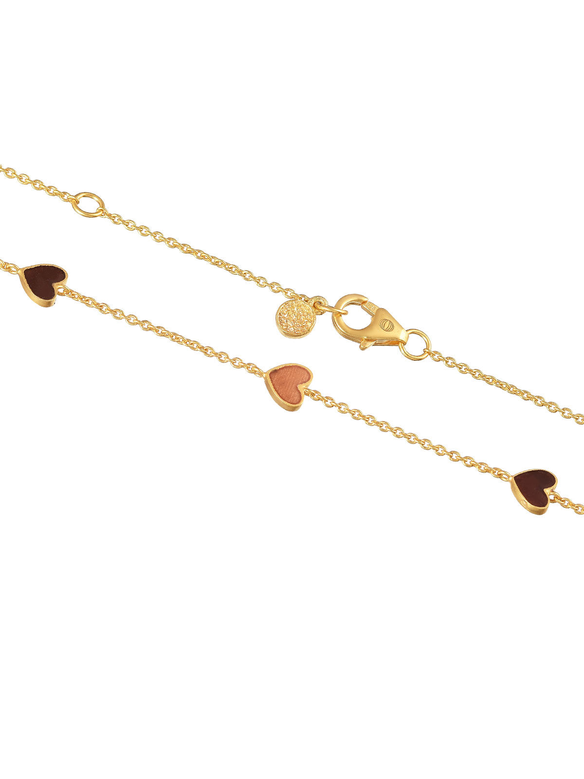Detailed view of enamel heart pendant on a gold necklace