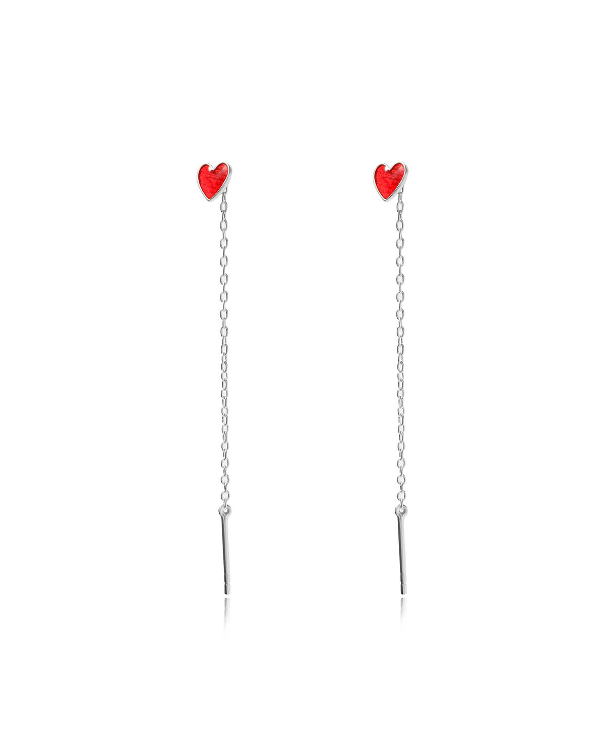 Silver earrings with red enamel heart charms in a delicate design