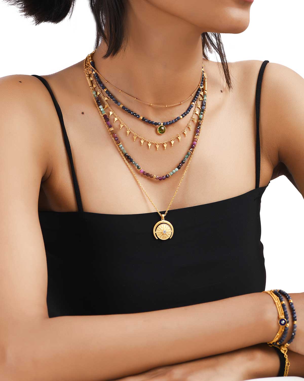A model wearing many kind of women's jewellery in Gold necklaces