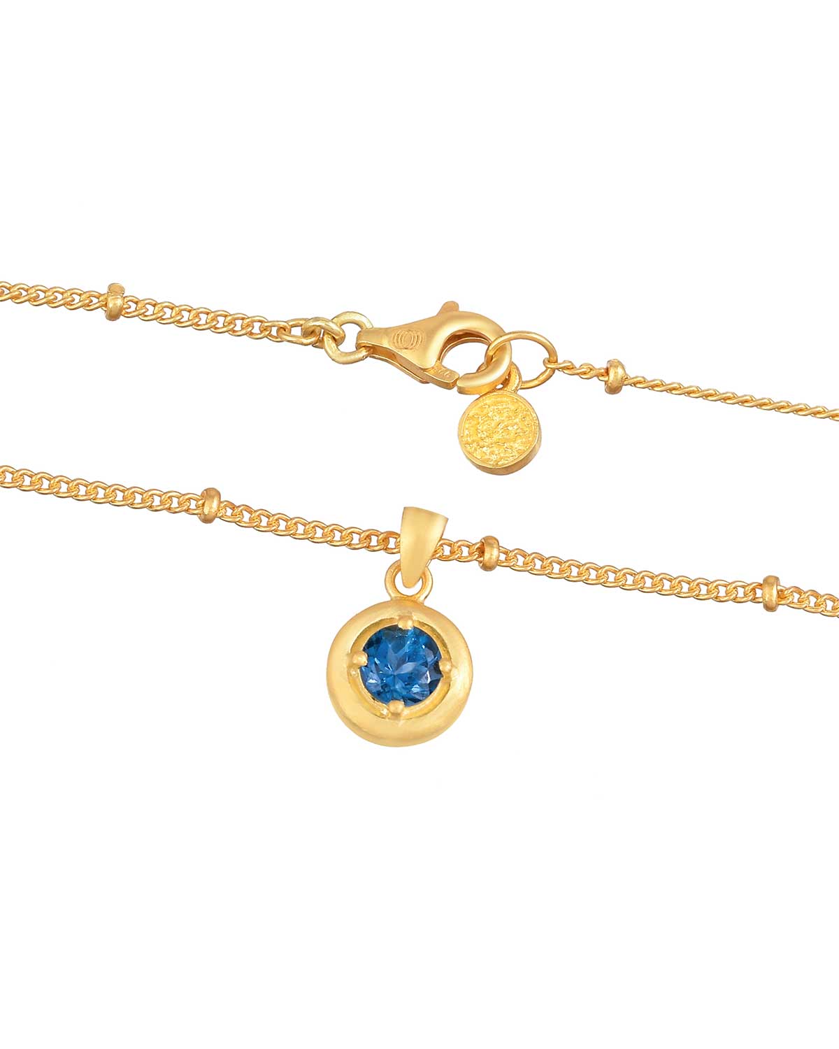 Gold vermeil necklace with deep blue topaz gemstone pendant