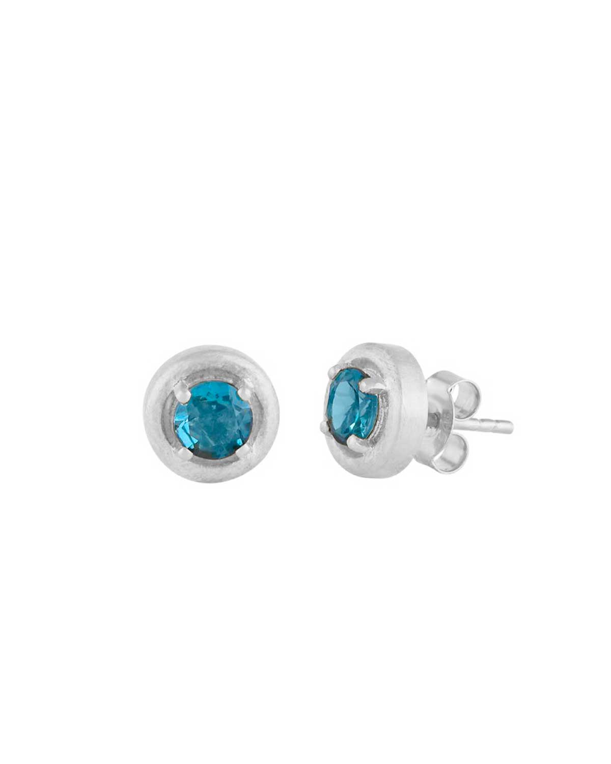 Sterling silver stud earrings with deep blue topaz gemstones