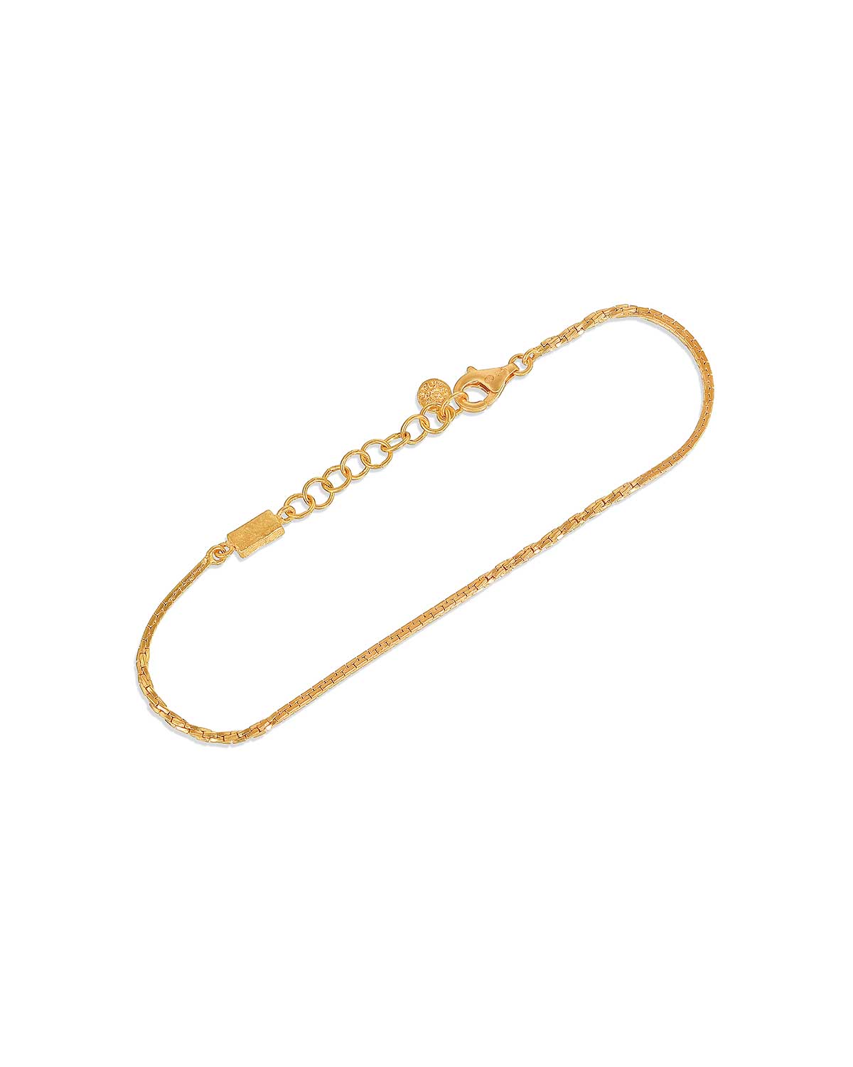 Close-up showing detailed patterns of the gold adjustable bracelet