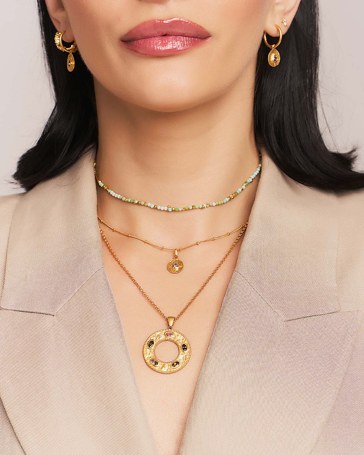 Multicolour tourmaline gold necklace styled in a layered look