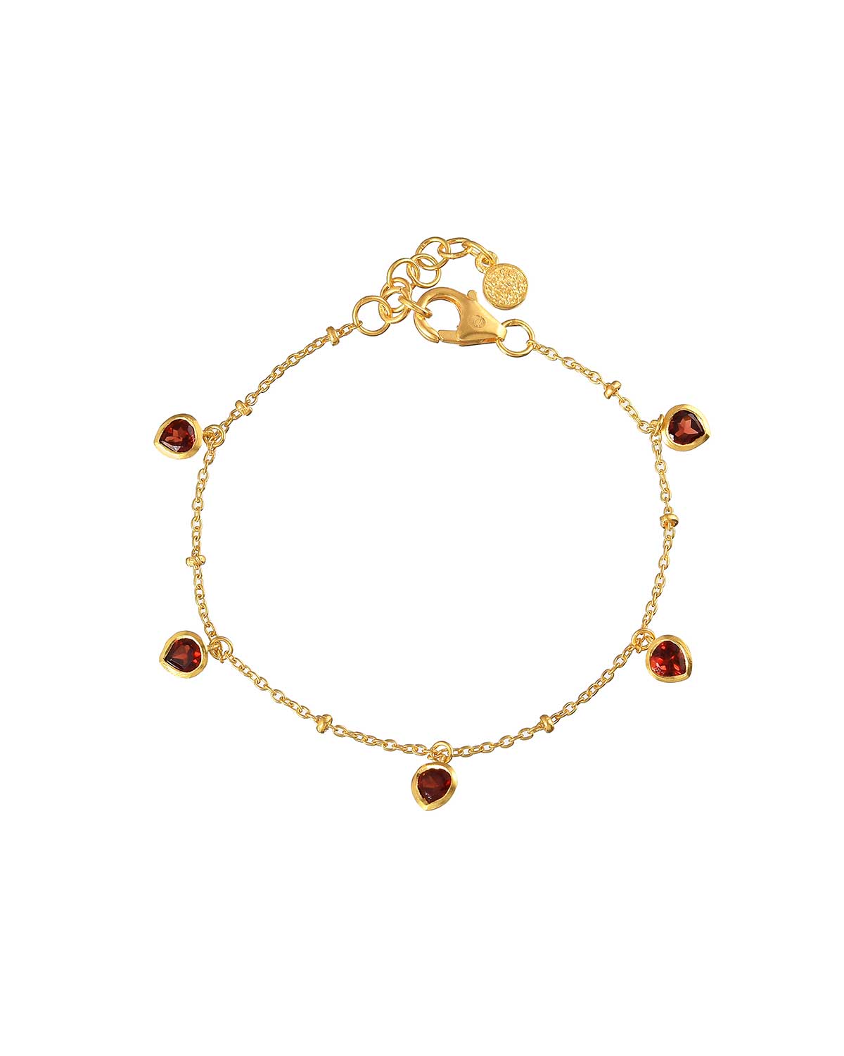 Gold adjustable bracelet with a garnet heart charm and polished finish