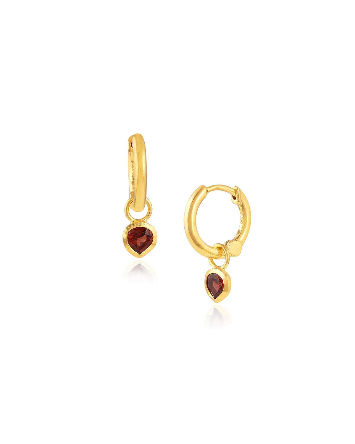Gold mini hoop earrings with removable garnet heart charms and a polished finish