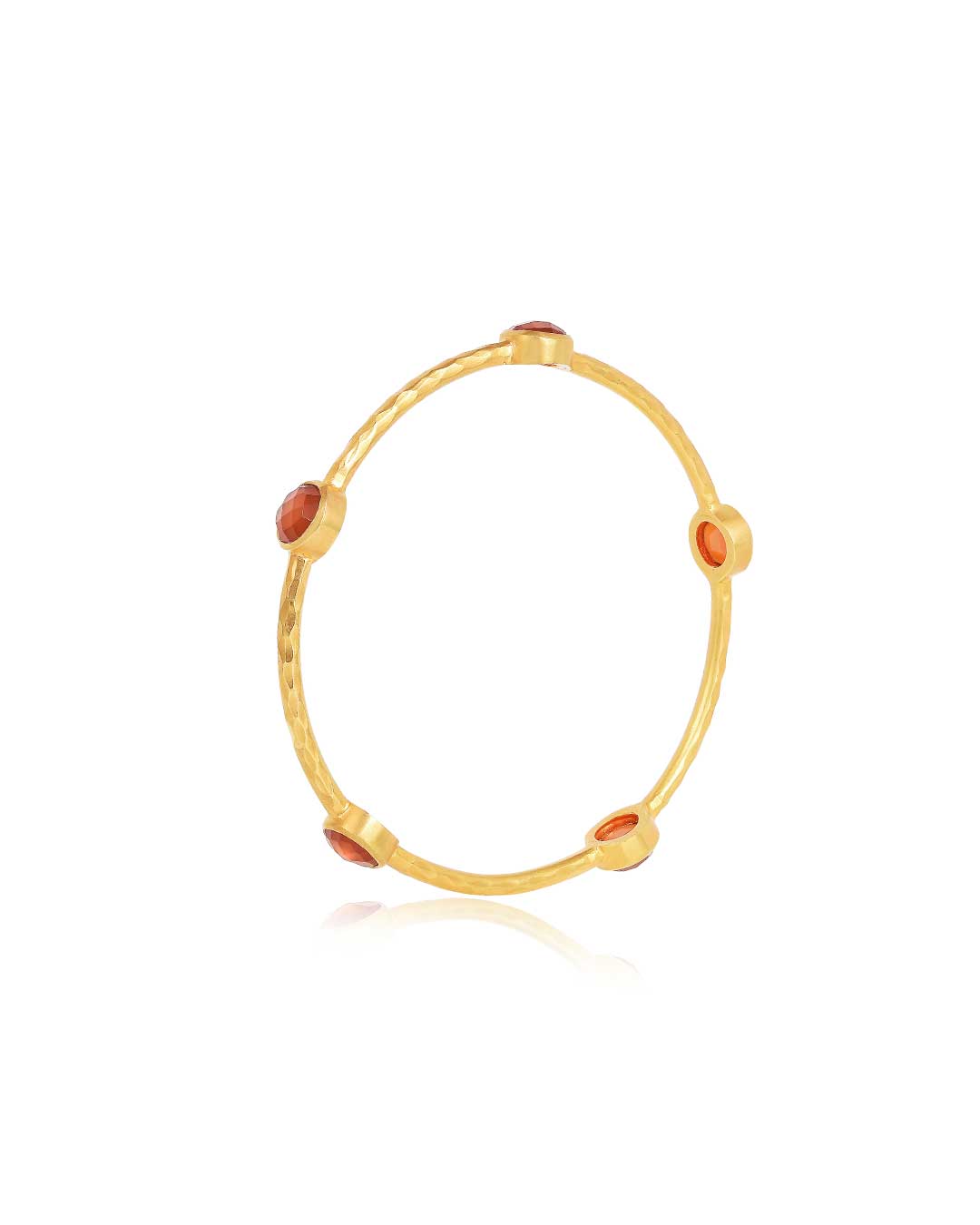 Handmade gold bangle with a hammered finish and natural carnelian gemstone