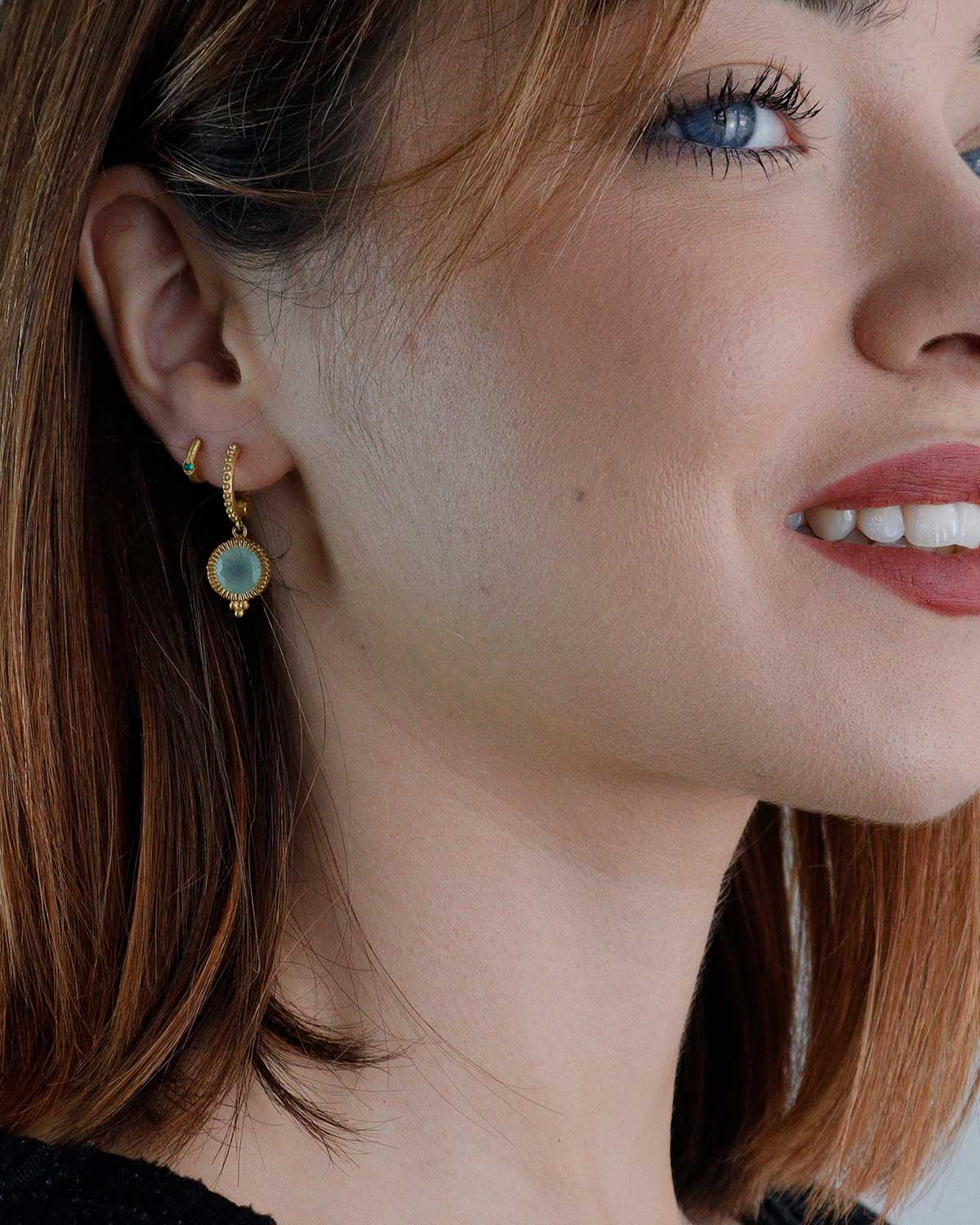 Gold mini hoop earrings with green onyx styled for stacking