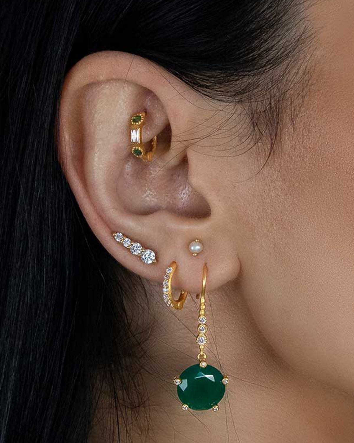 Gold mini hoops with easy open close click clasp and emerald gemstones