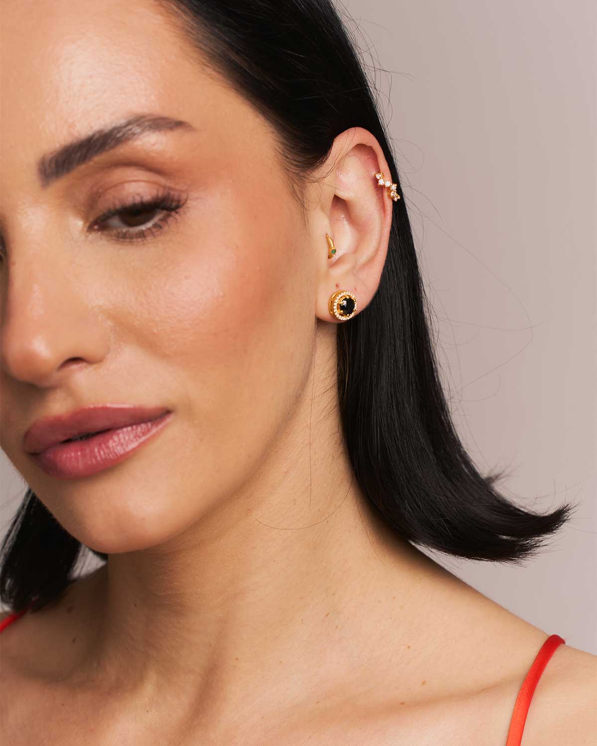 Gold stud earrings with labradorite gemstones and polished finish