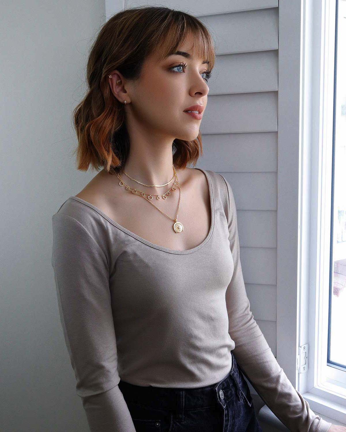 Minimal gold vermeil necklace with a circular pendant and diamond