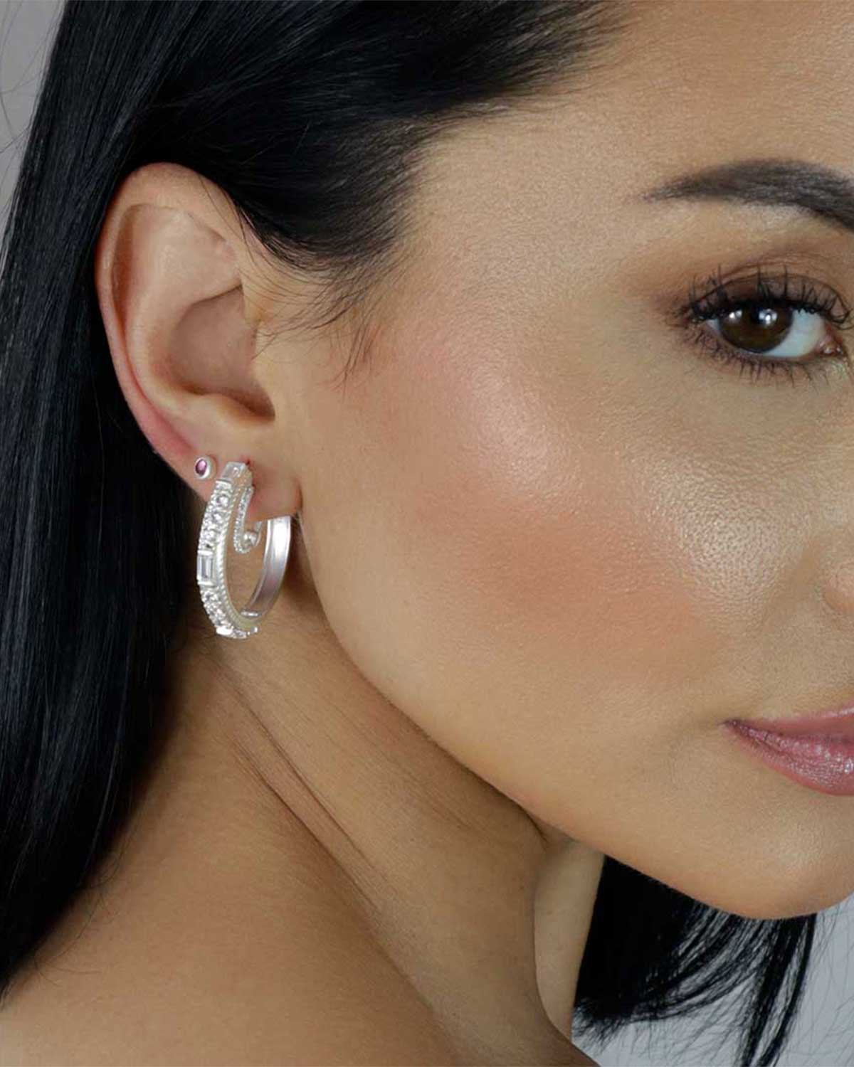 Close-up of silver hoops with mixed rainbow moonstone and labradorite gemstones