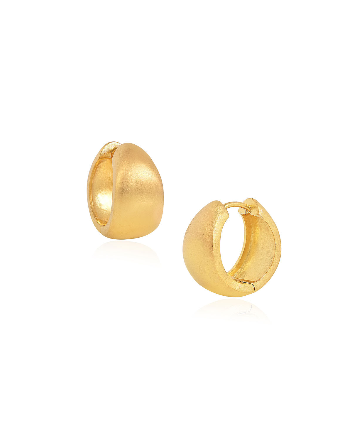 Detailed view of gold mini hoop earrings with a satin silky finish