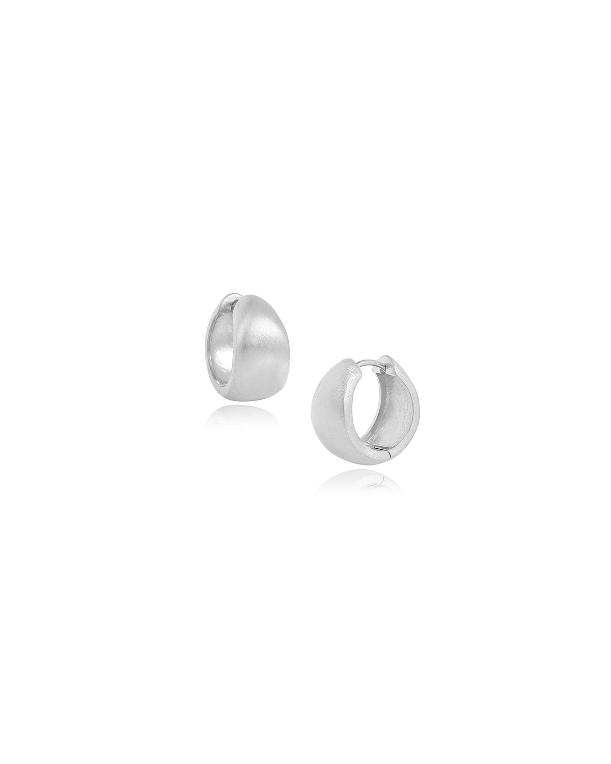 Minimalist silver mini hoop earrings with a smooth satin texture and chunky shape