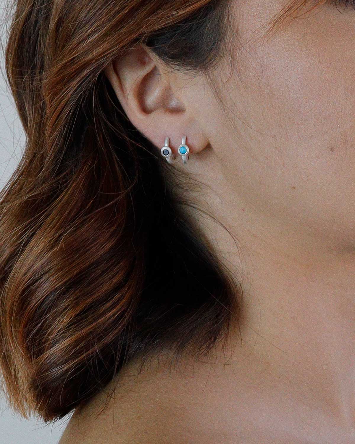 Lightweight silver mini hoop earrings with hand-cut gemstones