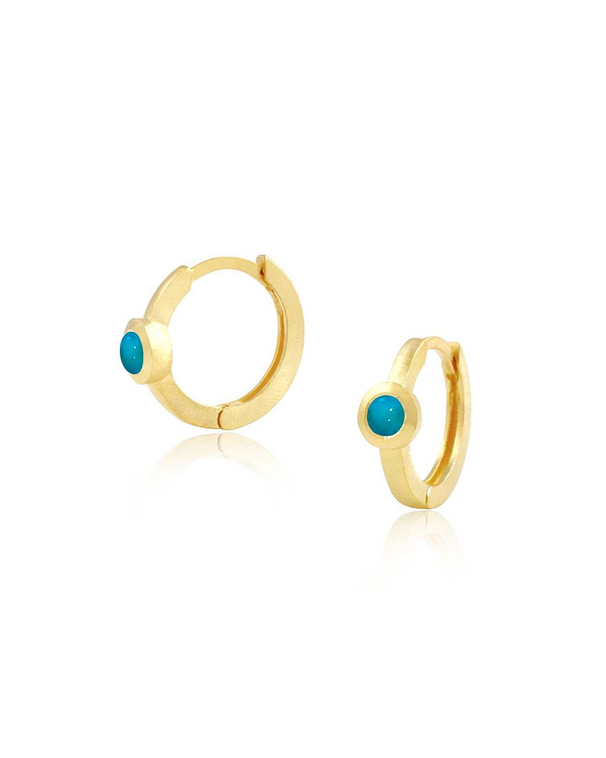 Gold huggie earrings with turquoise gemstones in a minimal design