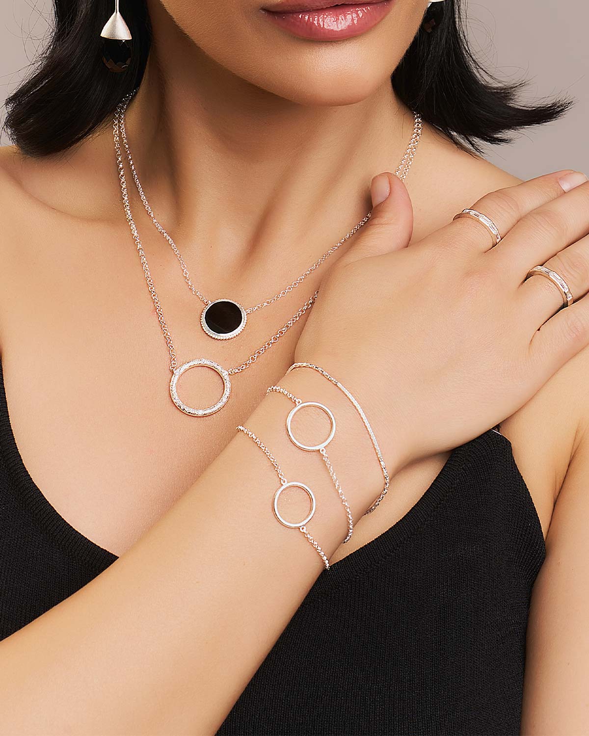 Model wearing a sterling silver adjustable bracelet with double chain detailing