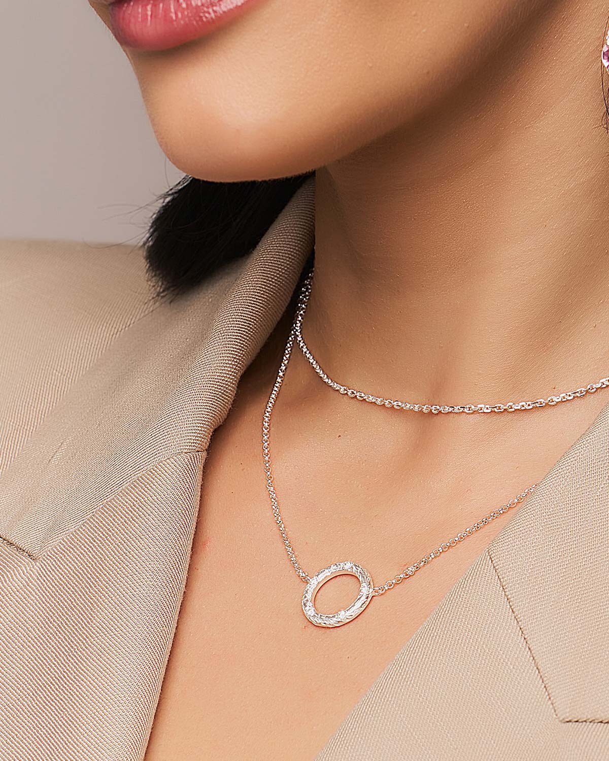 Sterling silver necklace with smaller diamond-studded circular pendant