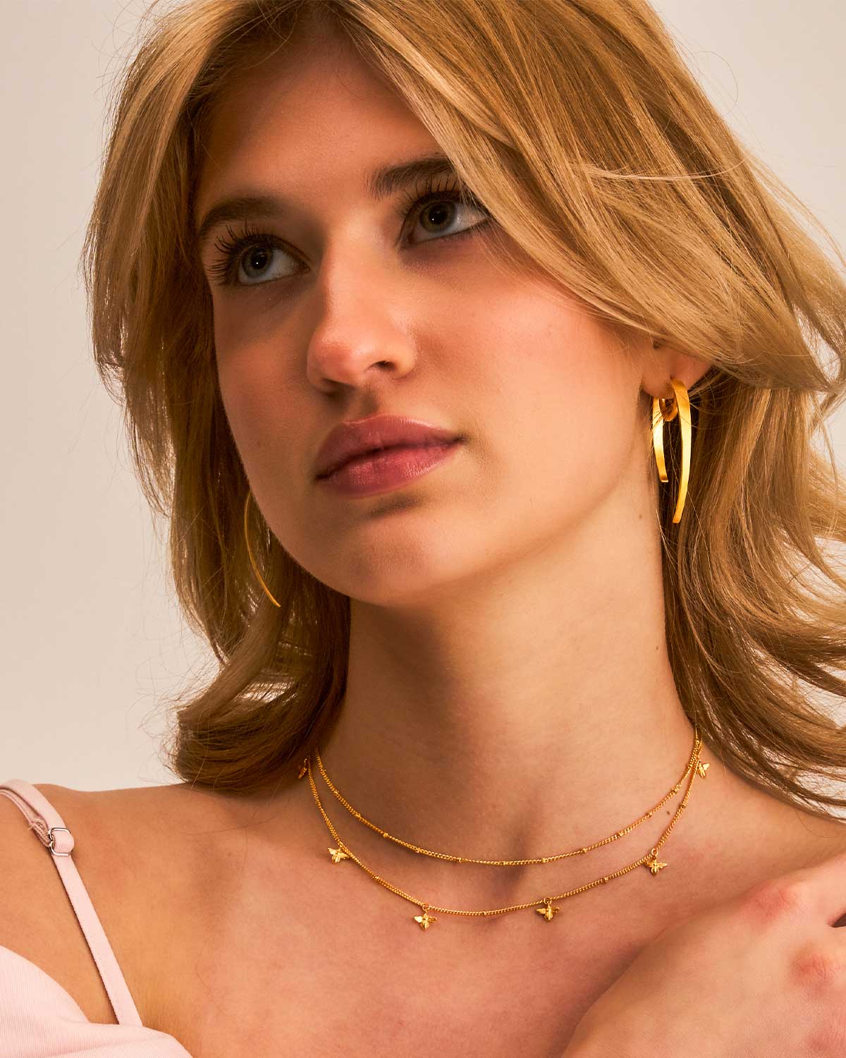 Spiky gold hoop earrings with a polished gold vermeil finish, designed for a modern chic look