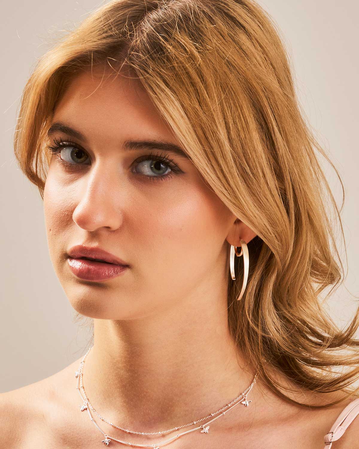 Front view of spiky sterling silver hoop earrings showing the unique spiked detailing