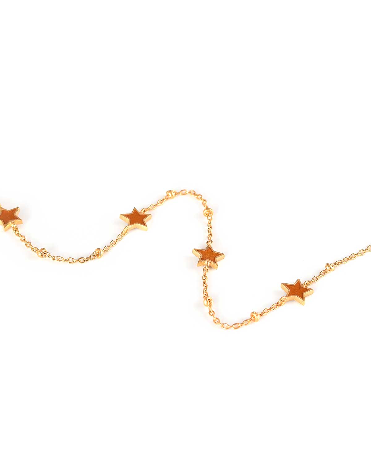 Close-up of a gold and silver adjustable bracelet with blue and orange enamel