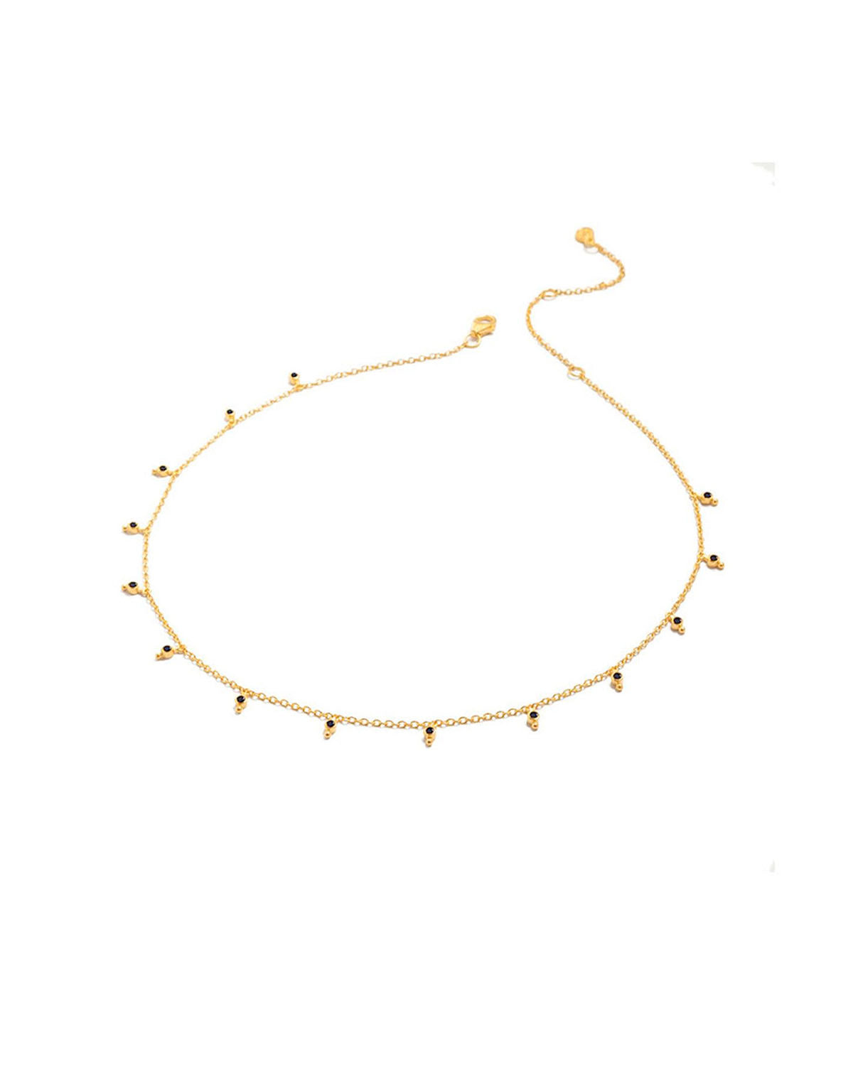 Black spinel gemstone necklace with a delicate gold chain and matte finish