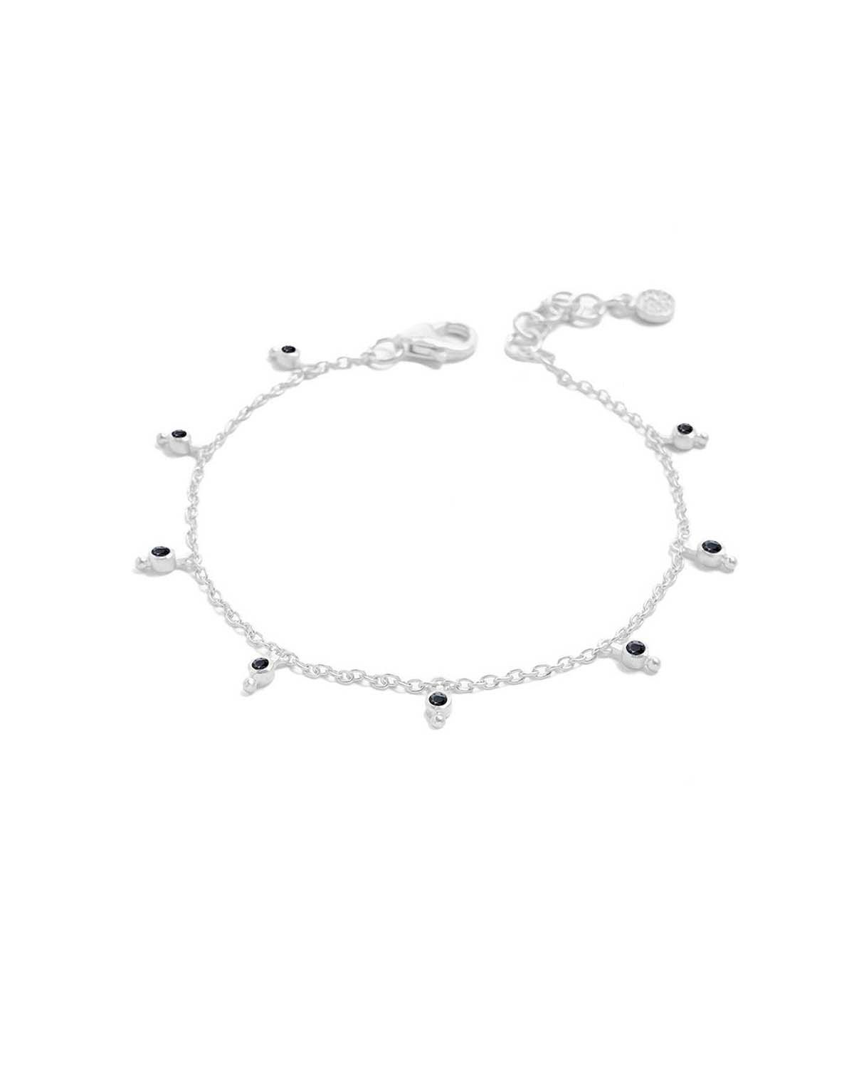 Silver bracelet with hand cut black spinel gemstones and delicate charm details