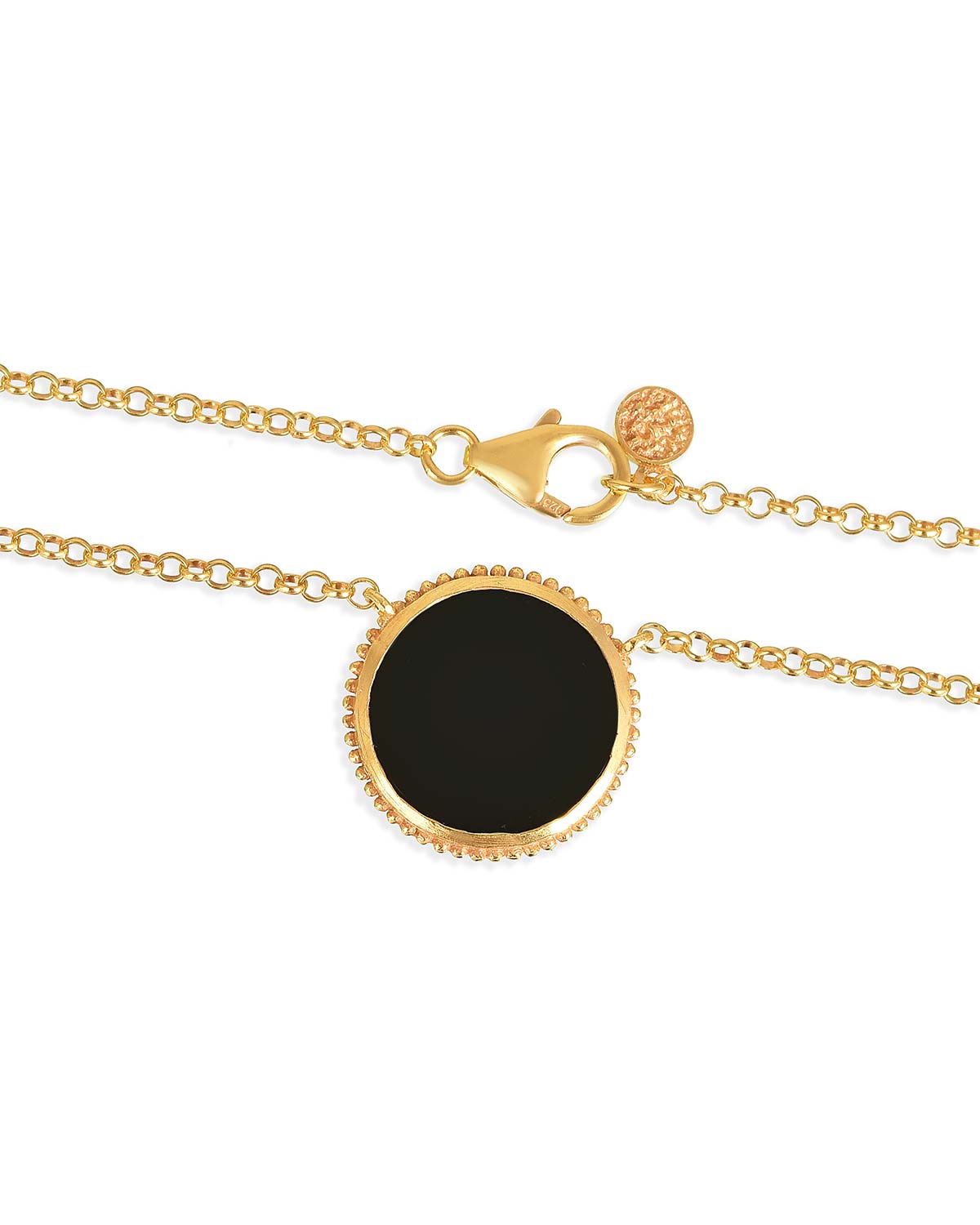 Gold necklace with black spinel gemstone believed to absorb negativity and provide calmness