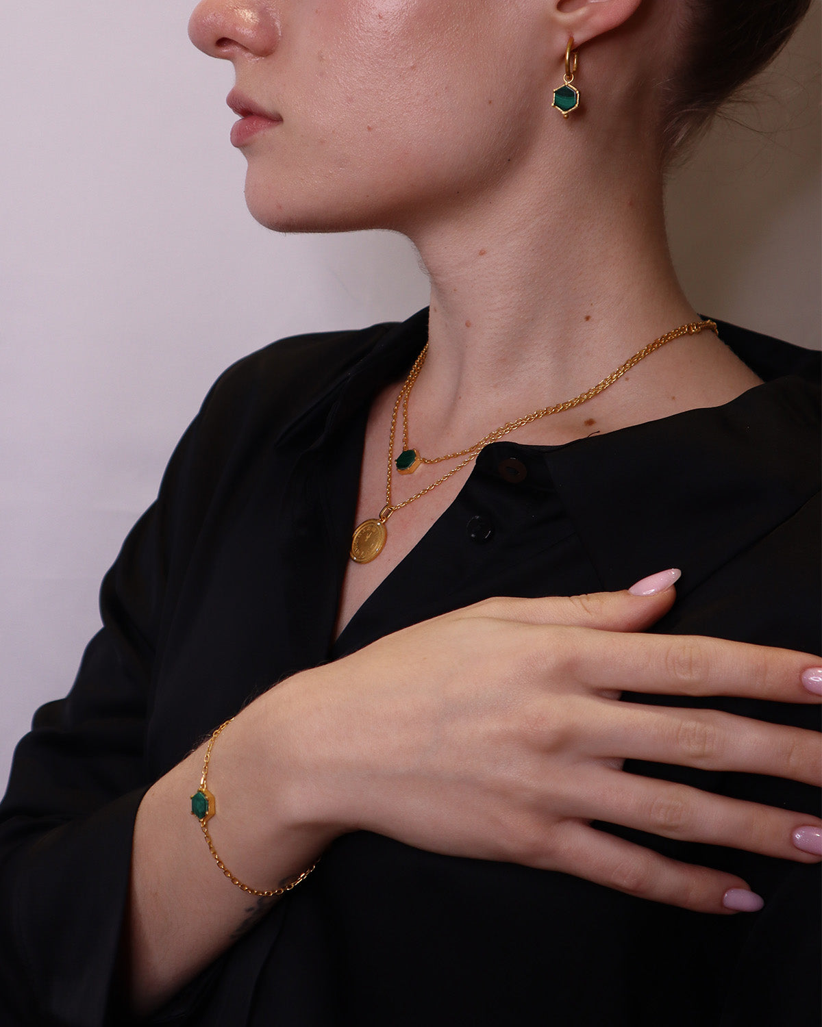 Adjustable gold and silver bracelet with a natural malachite gemstone
