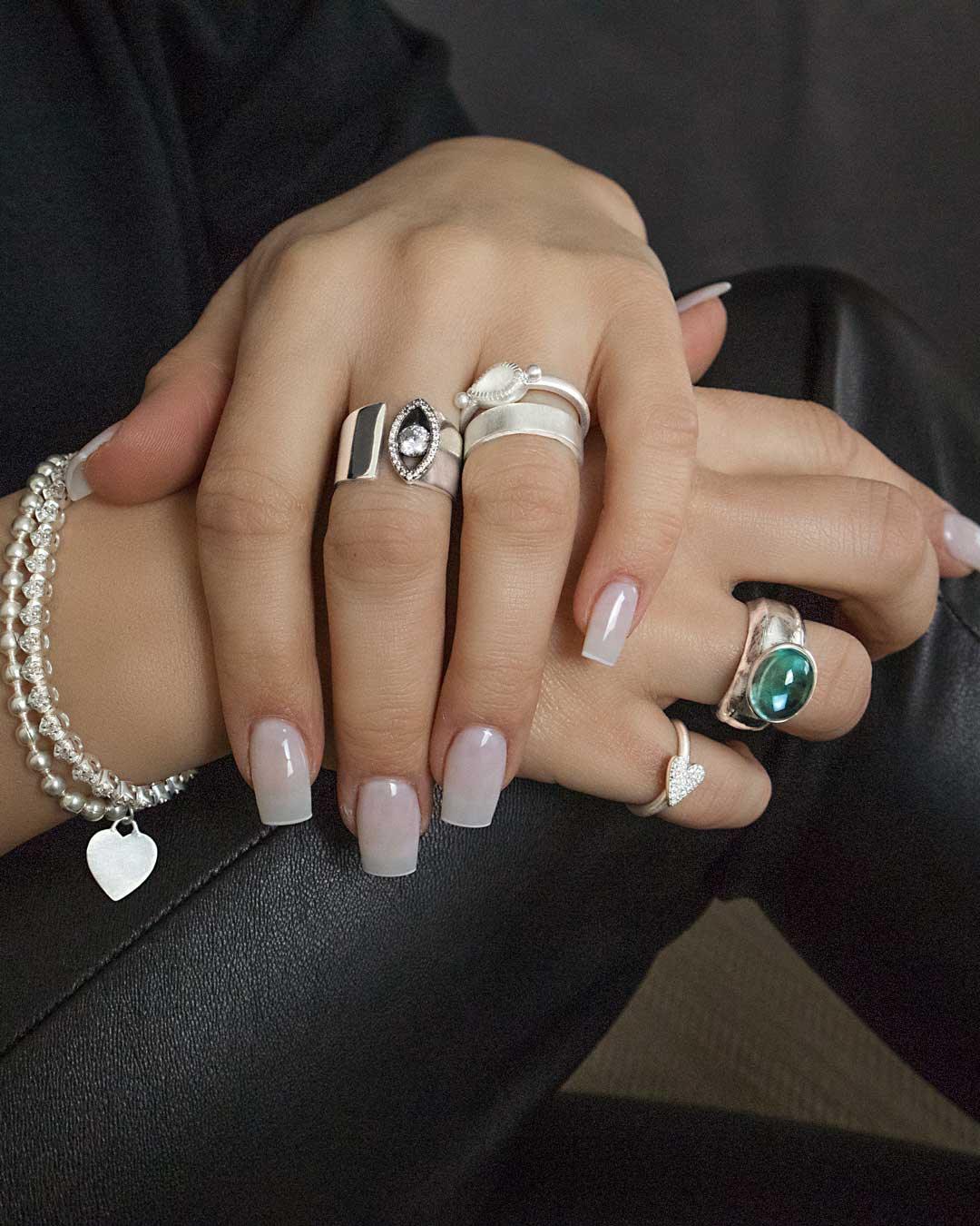 Close-up of symbolic eye silver ring with diamond-cut cubic zirconia