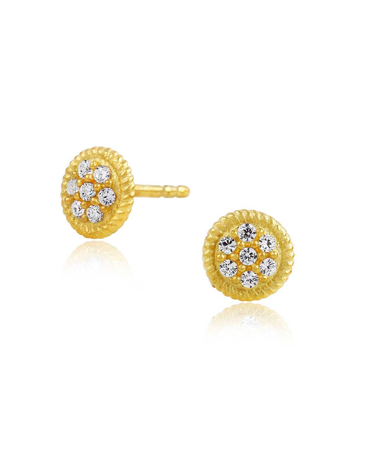 Tiny circular gold stud earrings with a sparkly and lightweight design