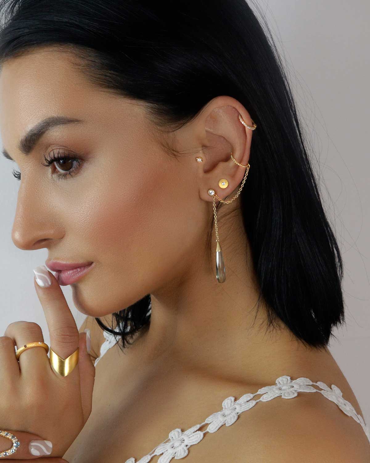 Earrings creating a multi piercing look with green amethyst gemstone