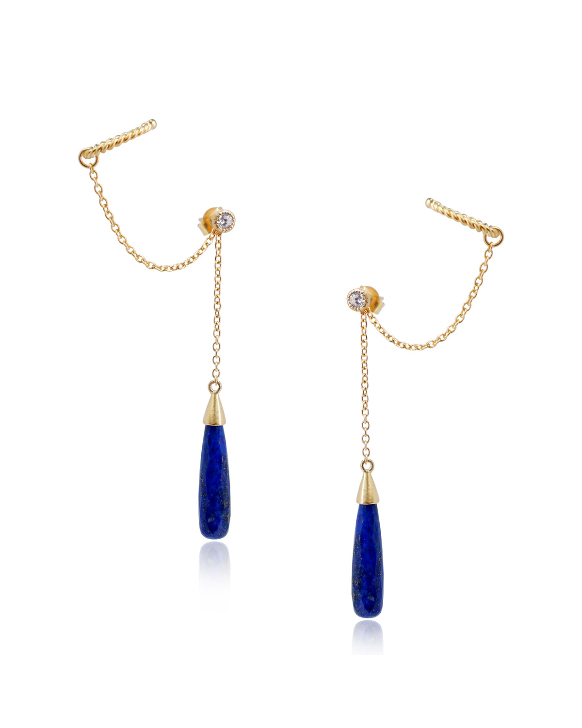 Close-up of gold vermeil earrings with lapis lazuli gemstones
