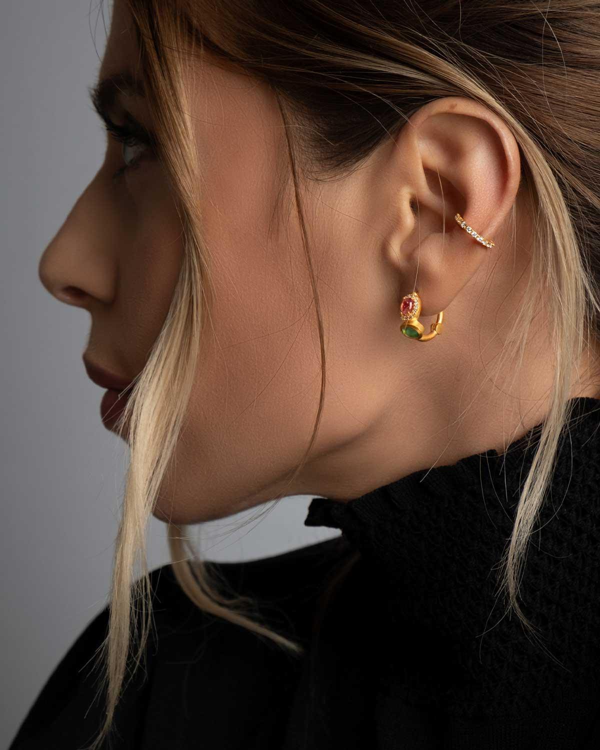 Gold mini hoops with mixed tourmaline styled in a stacked earring look