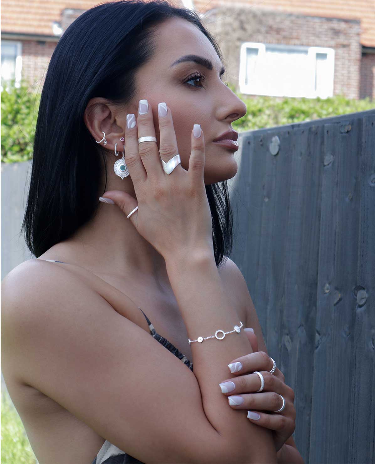 Model wearing delicate silver bracelet with crystal sparkle