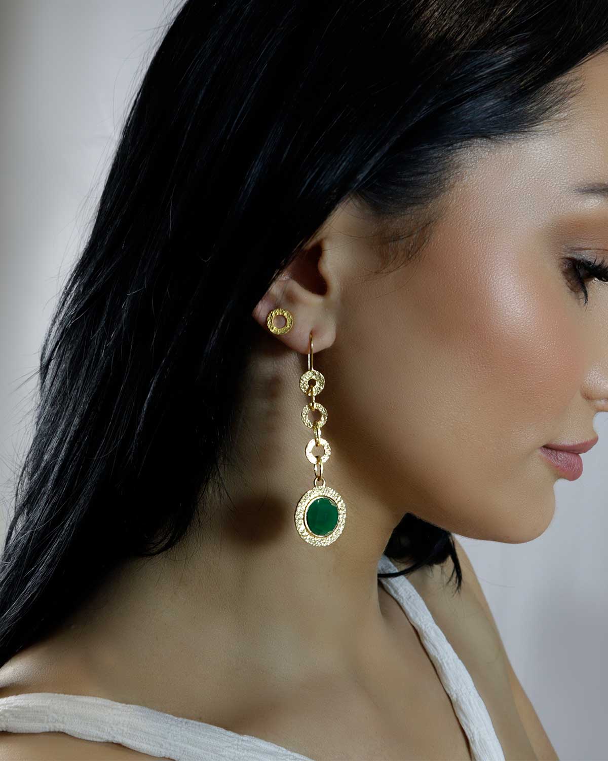 Gold drop earrings with emerald green gemstones and secure ear loop