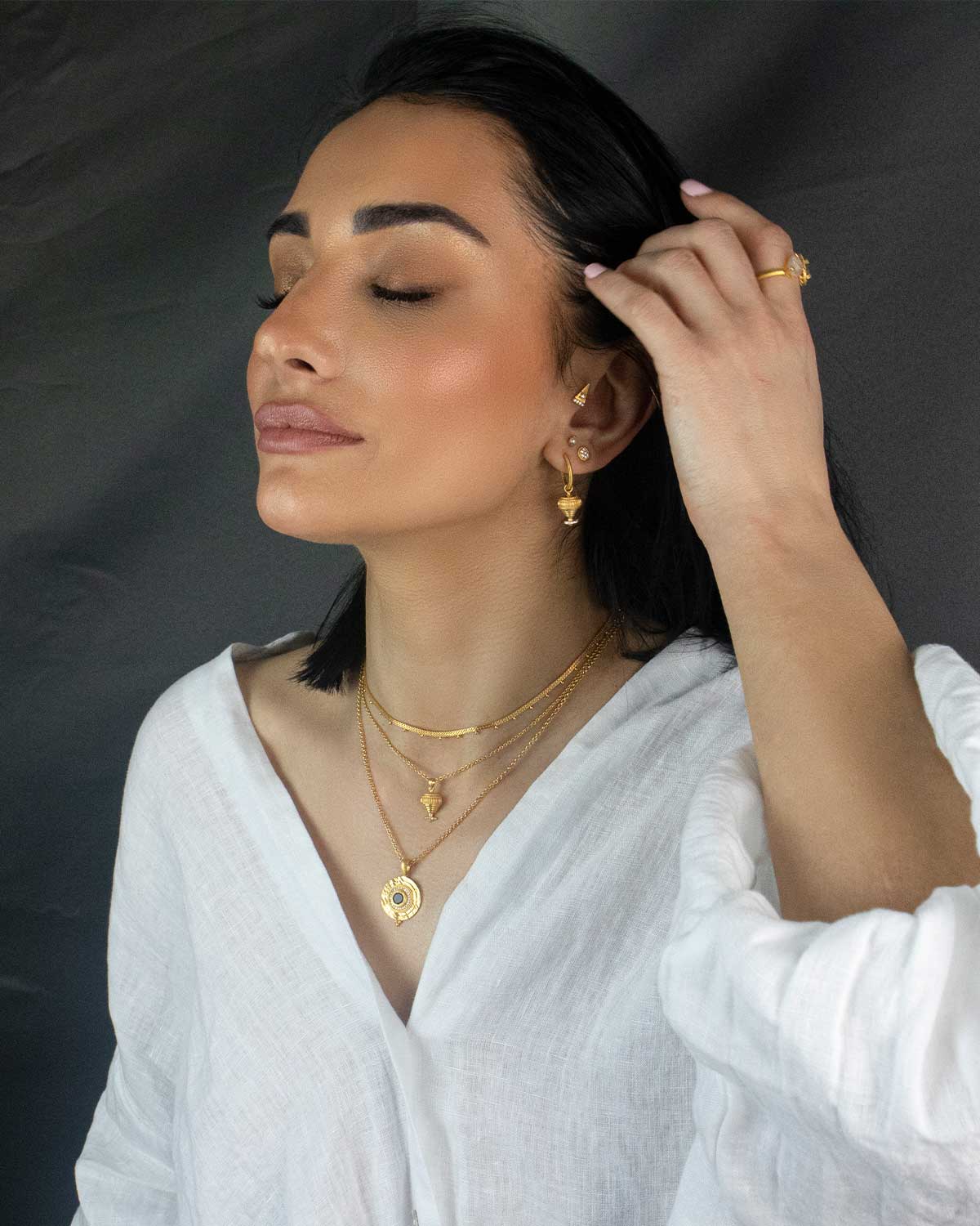 Model wearing silver necklace with labradorite and aqua chalcedony gemstones