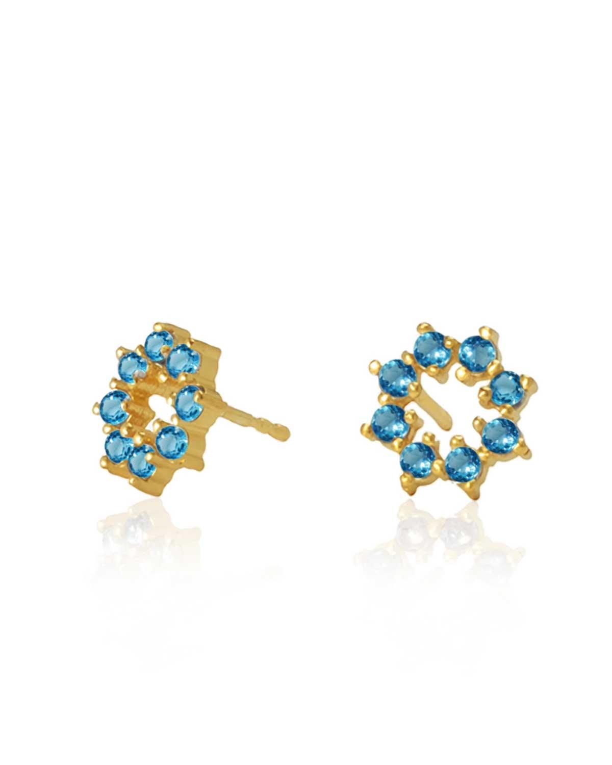 Tiny gold stud earrings with hand-cut blue topaz gemstones