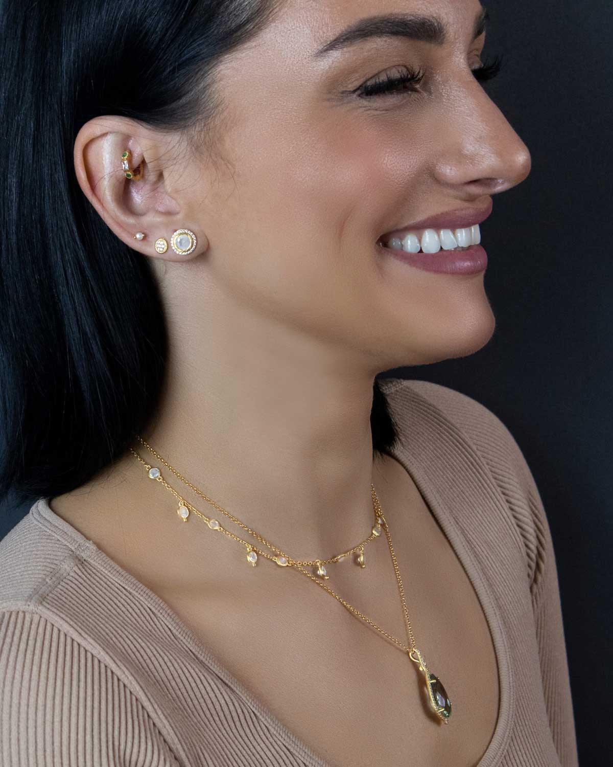 Model wearing silver adjustable necklace with rainbow moonstone gemstones