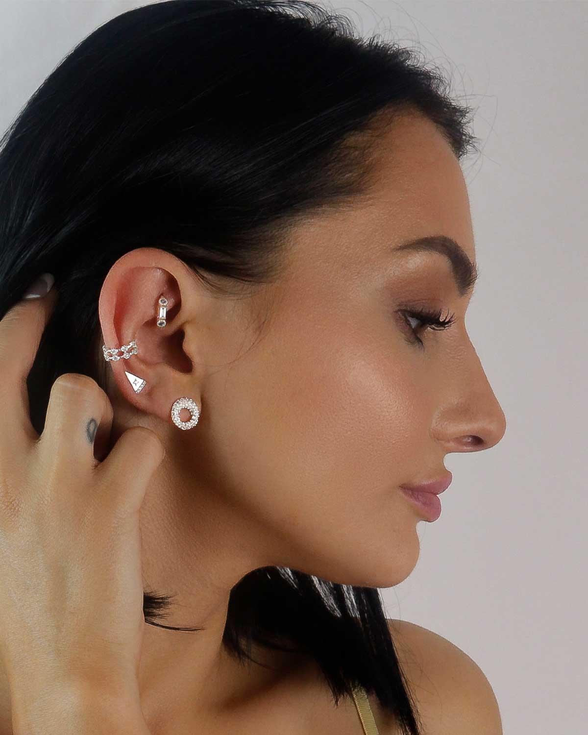 Close-up of spherical silver studs with AAA cubic zirconia detailing