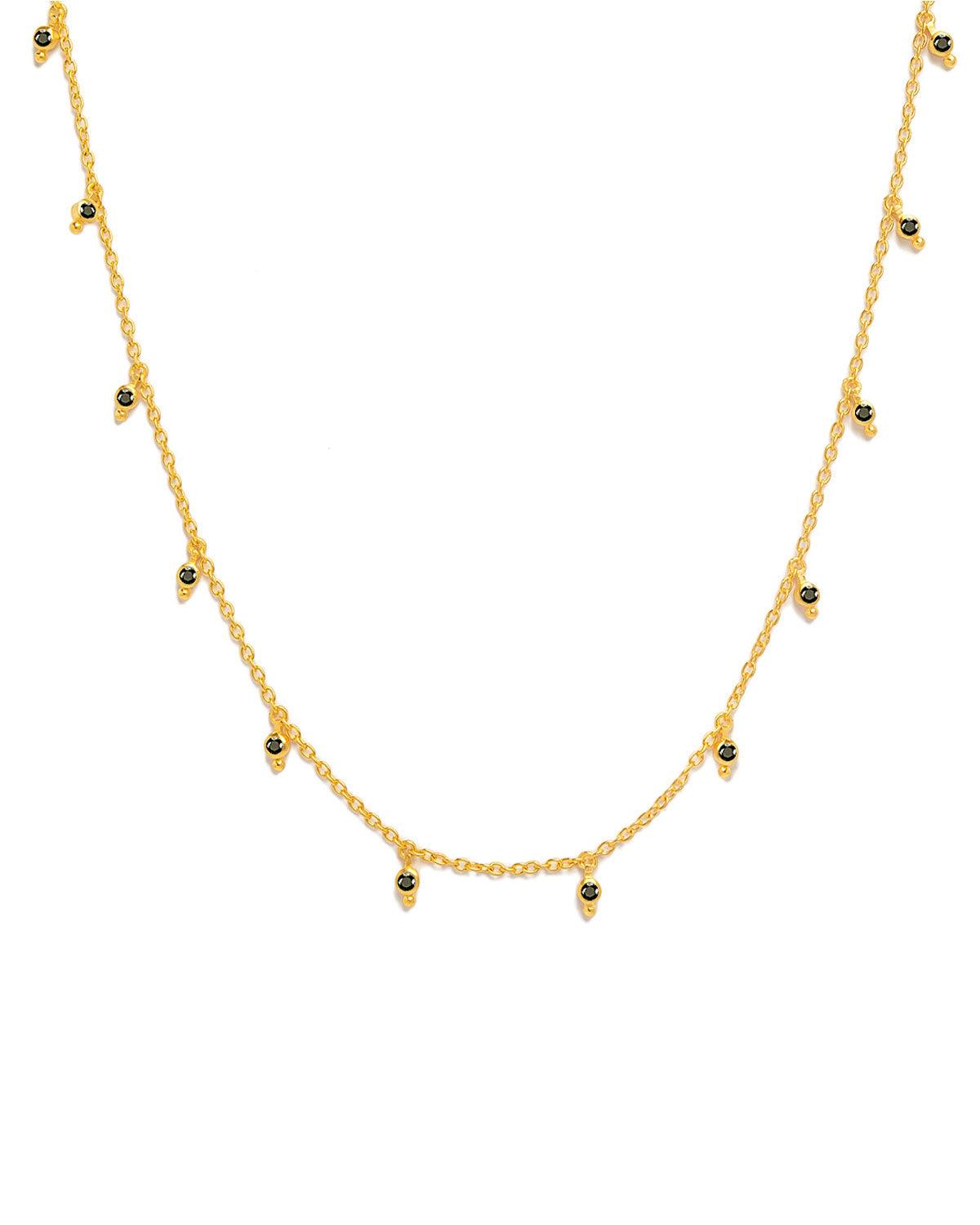 Detailed view of black spinel gemstones with handcrafted gold accents