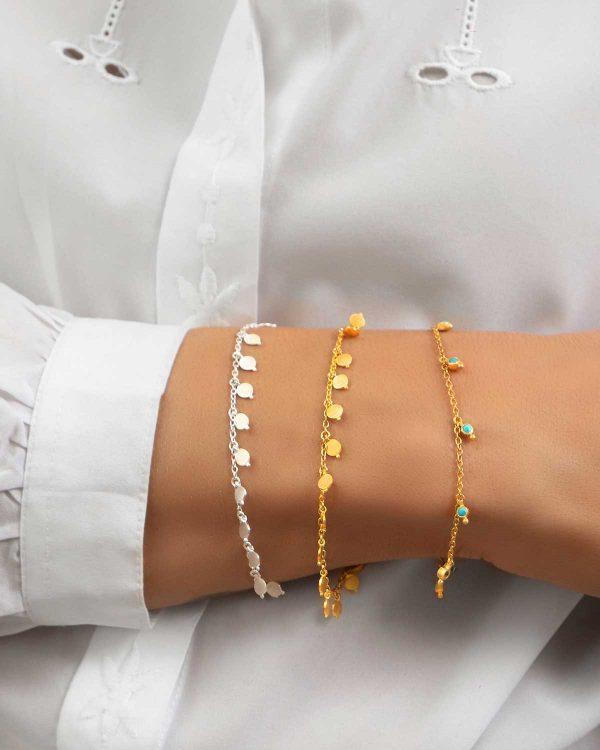Model wearing silver bracelet with black spinel gemstones